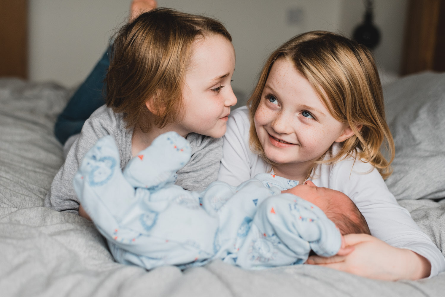 Sibling photos with new baby brother Lorraine Maguire Photography