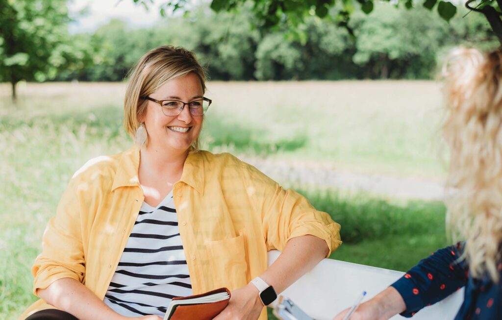 coach with client for outdoor coaching session