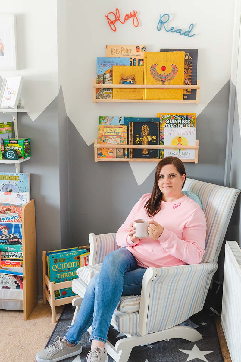 woman sitting in reading nook on rocking chair