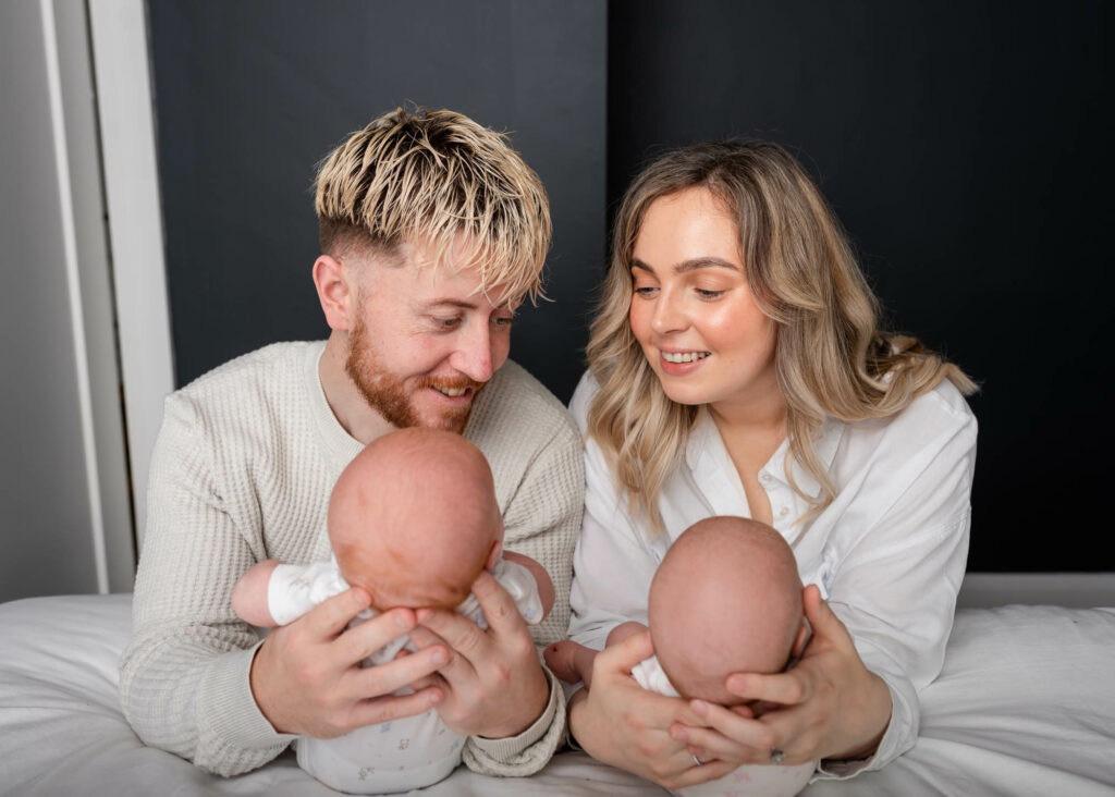 New parents doting on their new babies